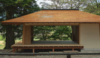 leaning timber frame anchors shrine office in japanese mountain valley