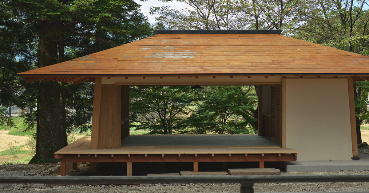 leaning timber frame anchors shrine office in japanese mountain valley