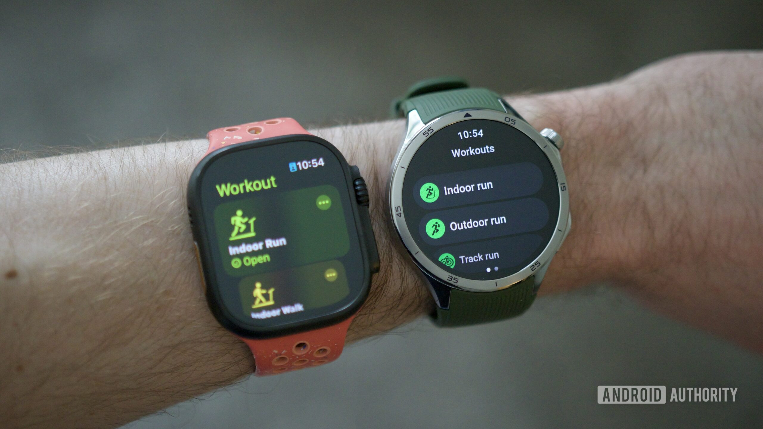oneplus watch 3 vs apple watch ultra 2 2 Someone wearing an Apple Watch Ultra 2 and OnePlus Watch 3.