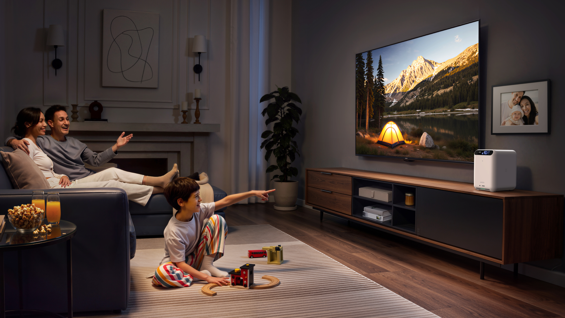 Family around TV with UGreen HomeAgent