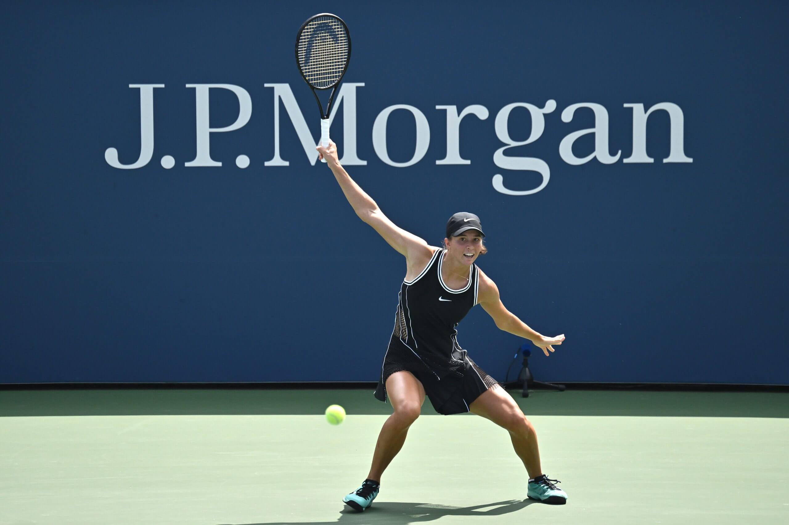 Lilli Tagger follows through a one-handed backhand.