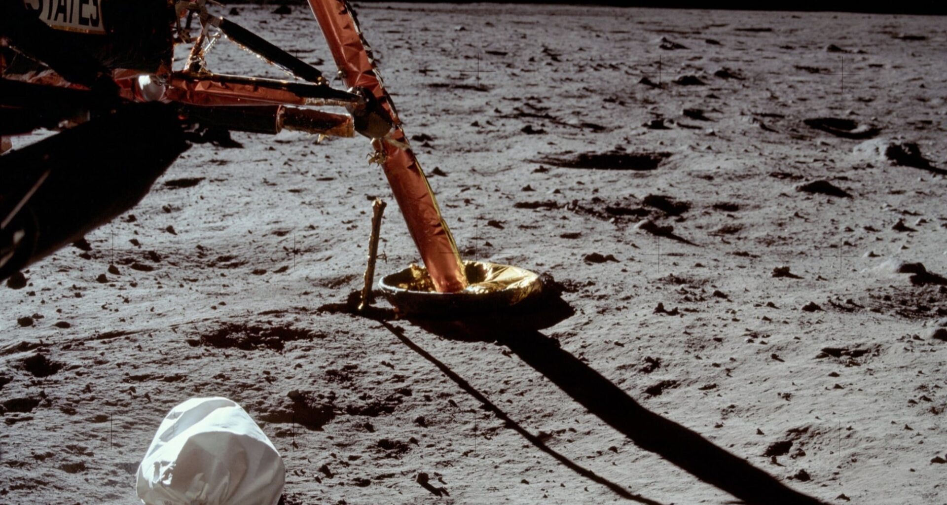 Across six Apollo landings, astronauts left a commonly cited 96 waste bags and containers on the Moon. Researchers have proposed retrieving one—not to clean up, but to discover whether any human microbes survived up to 57 years of lunar radiation, vacuum and extreme temperature swings.