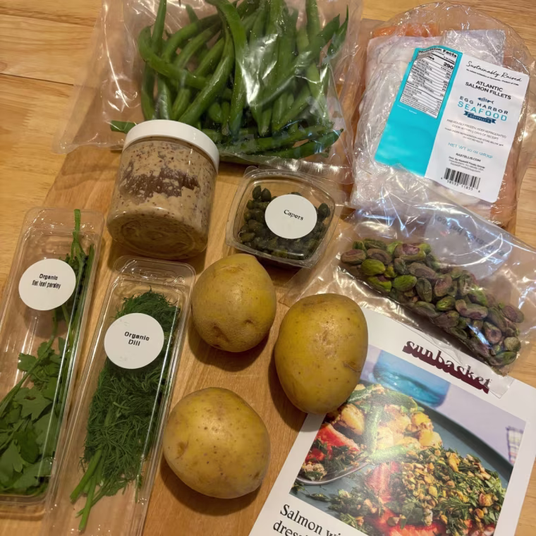 Groceries and recipe card on wooden table