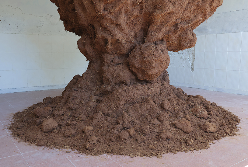 bomb cloud sculpture takes shape in soil, straw and water inside abandoned lisbon school - 4