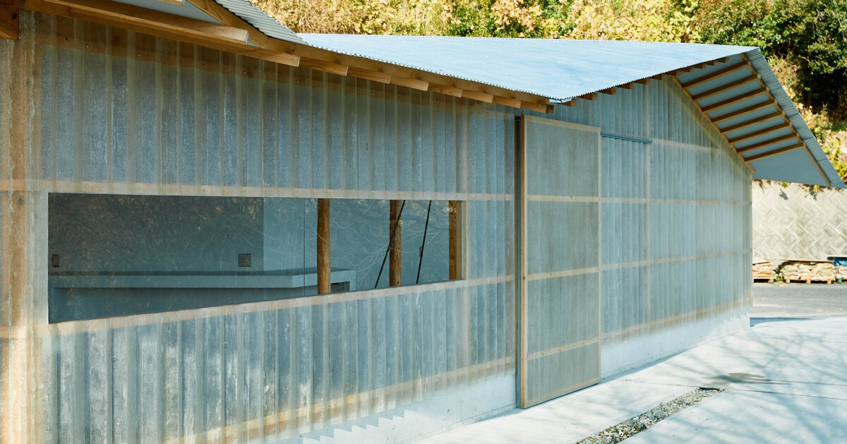 triangular timber structure encloses tsukumo kiln ceramic studio in japan