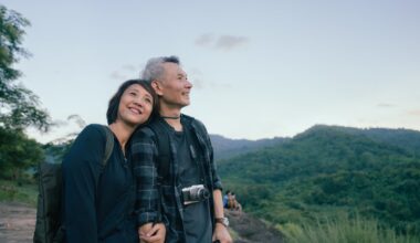 Two smiling people out for a hike.