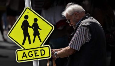 An elderly person and a sign saying 'aged'