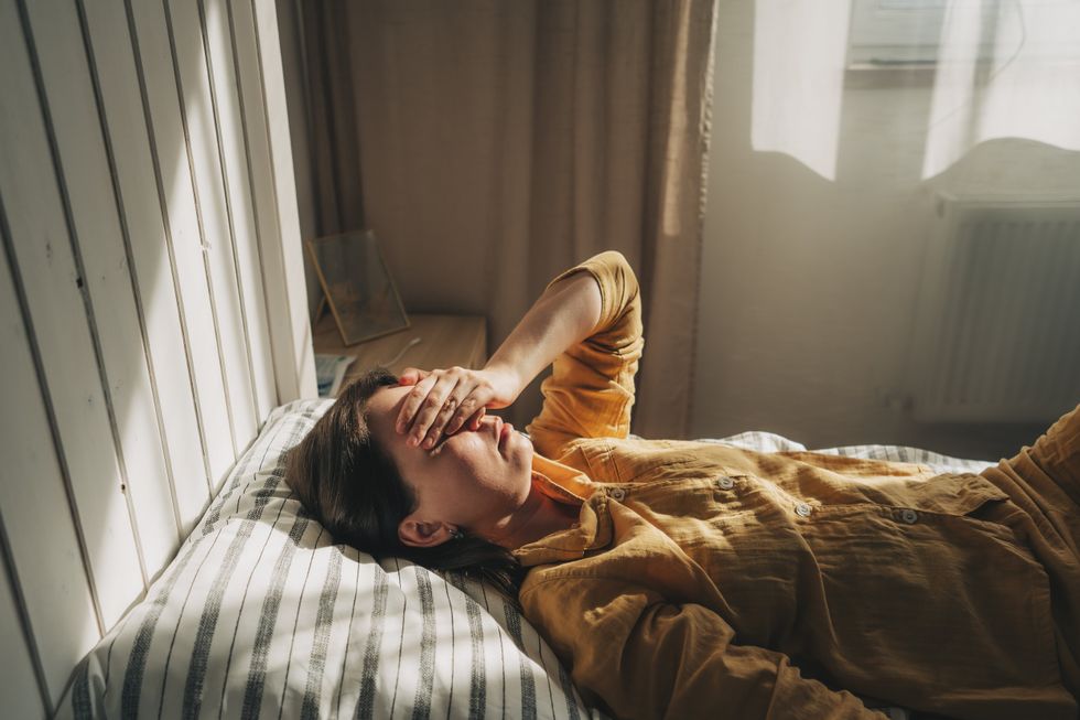 Woman sick in bed