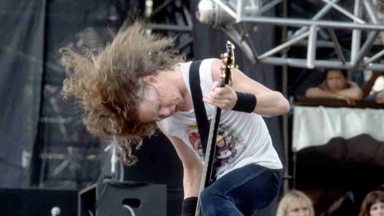 Metallica&rsquo;s Jason Newsted performing onstage in 1988