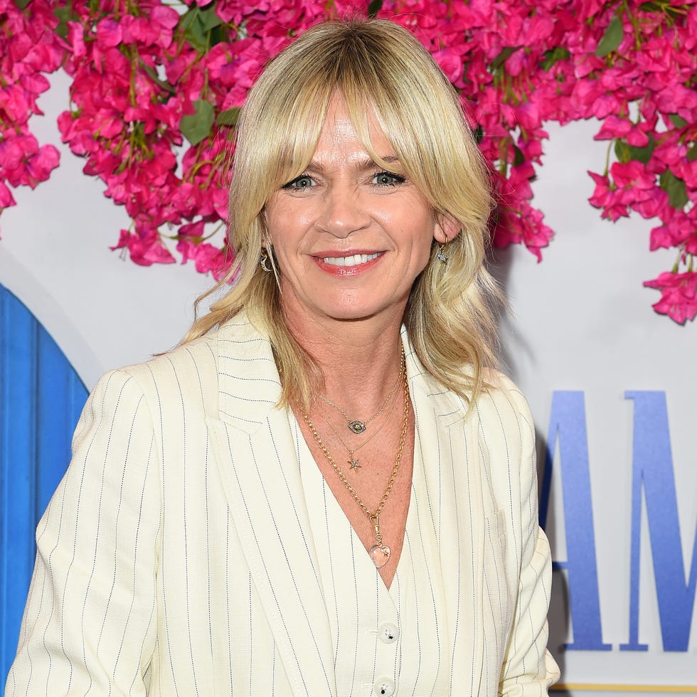 zoe ball in a cream pinstripe suit with matching waistcoat