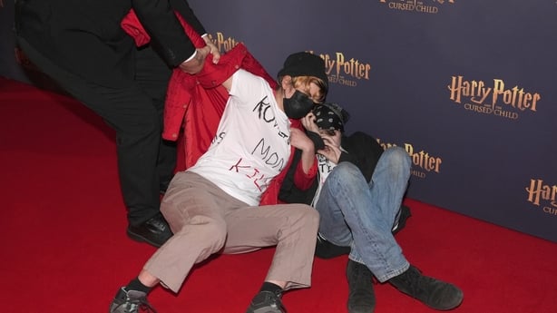 Trans-rights protestors on the red carpet at the gala performance of Harry Potter and the Cursed Child, at Palace Theatre in central London. Picture date: Thursday October 15, 2026. PA Photo. Photo credit should read: Jonathan Brady/the Press Association
