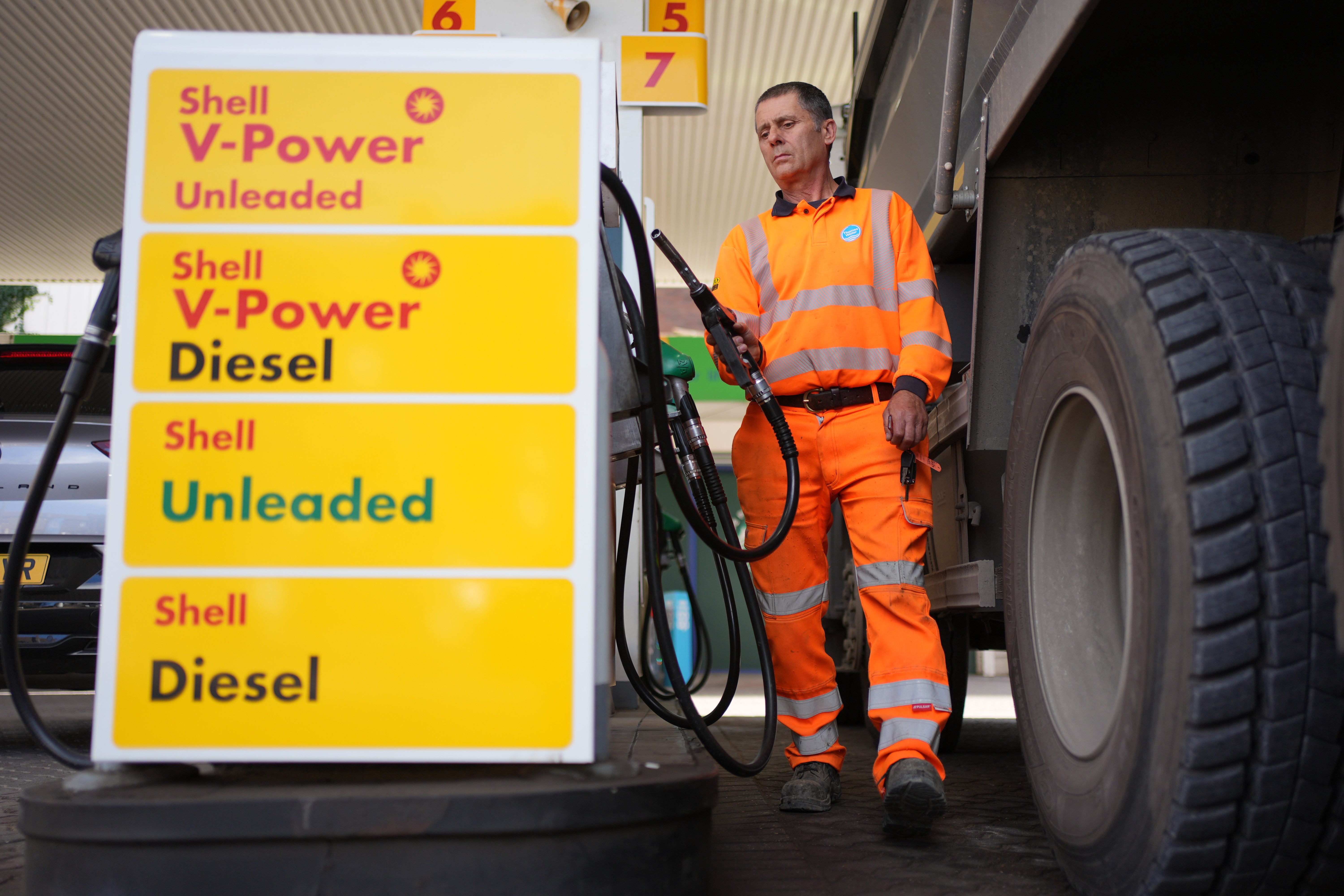 A Thames Water employee fills his lorry with diesel at 207.9p per litre at a petrol station in London