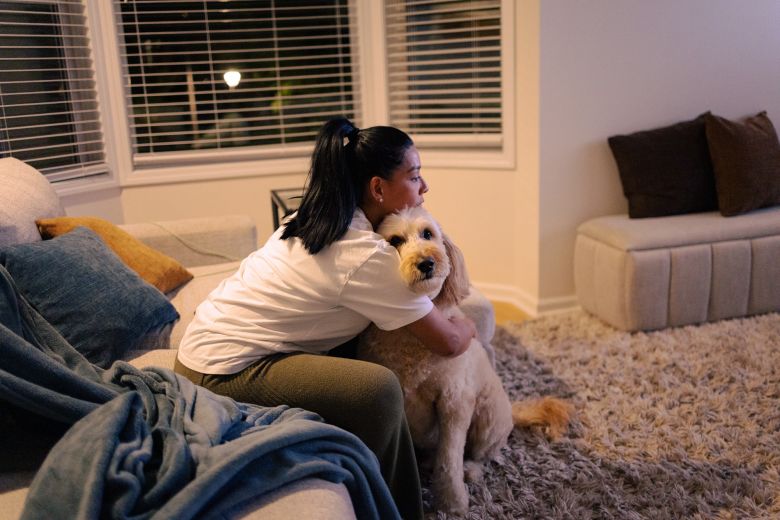 Mariza winds down with her dog, Leo, in the evening.