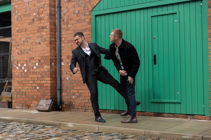 03_11_coro_adam_daniel_03 Daniel punches Adam in a scene from Coronation Street