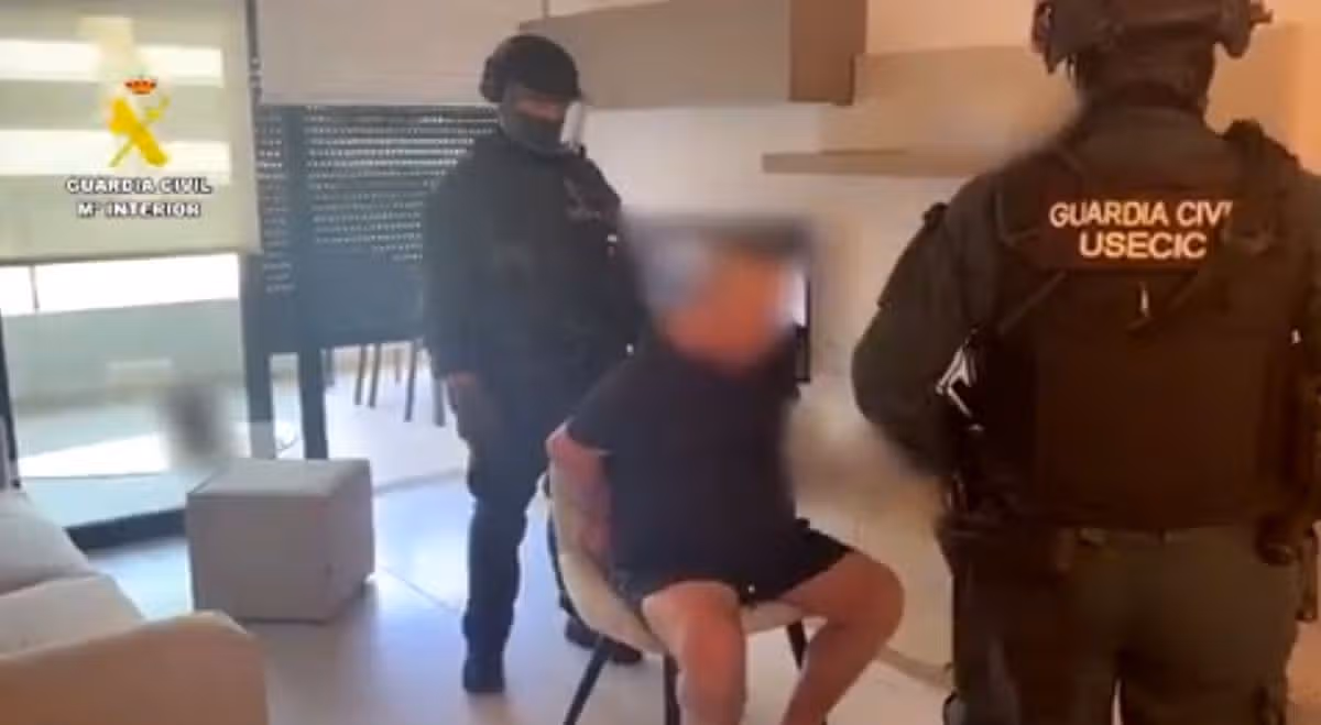 Philip Foster being arrested by armed Guardia Civil officers in the Orihuela Costa, Spain