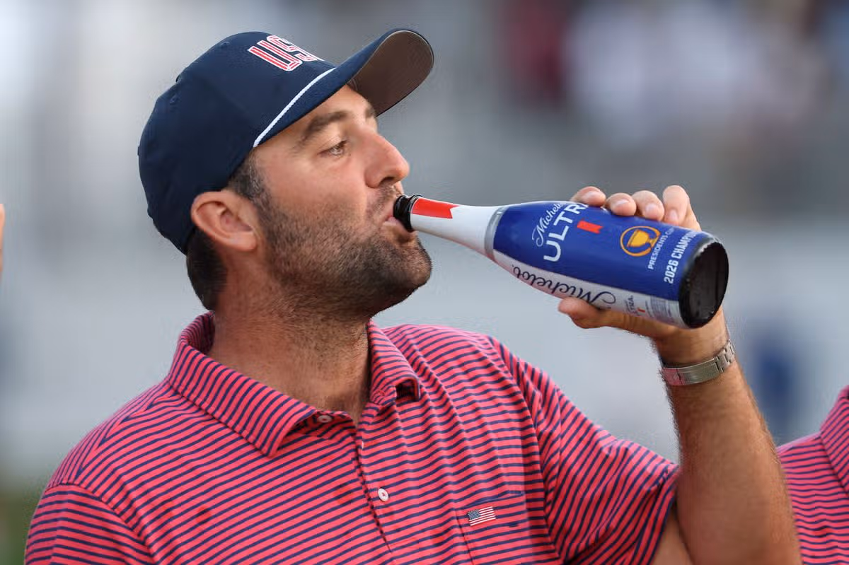 Scottie Scheffler of the U.S. Team celebrates their 17-13 win during the trophy ceremony following the Sunday's Singles on day four of the Presidents Cup 2026 at Medinah Country Club on September 27, 2026 in Medinah, Illinois