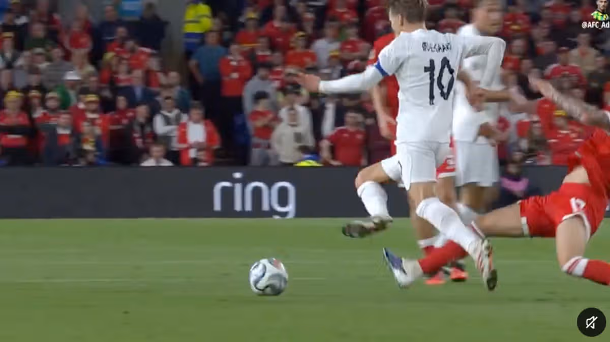 Martin Odegaard is tackled by Jordan James