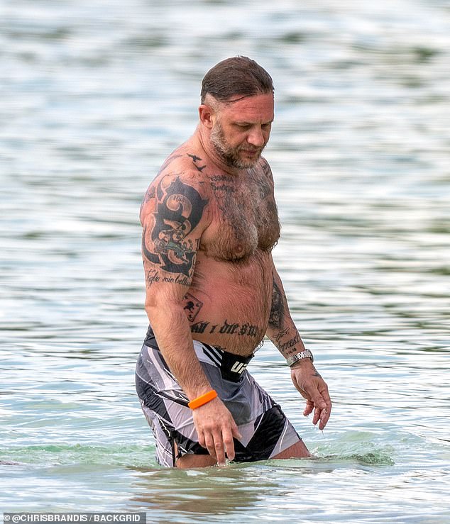 Hollywood star Tom Hardy was seen hitting the beach in Barbados (pictured)
