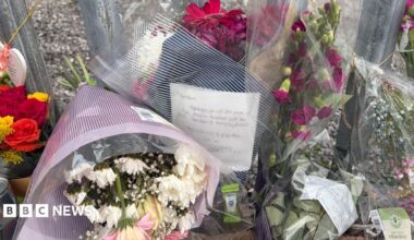 Floral tributes left at scene where woman found dead
