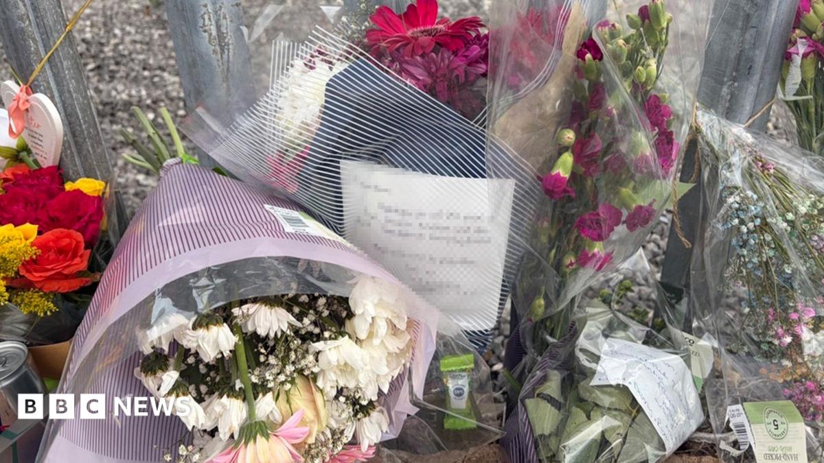 Floral tributes left at scene where woman found dead