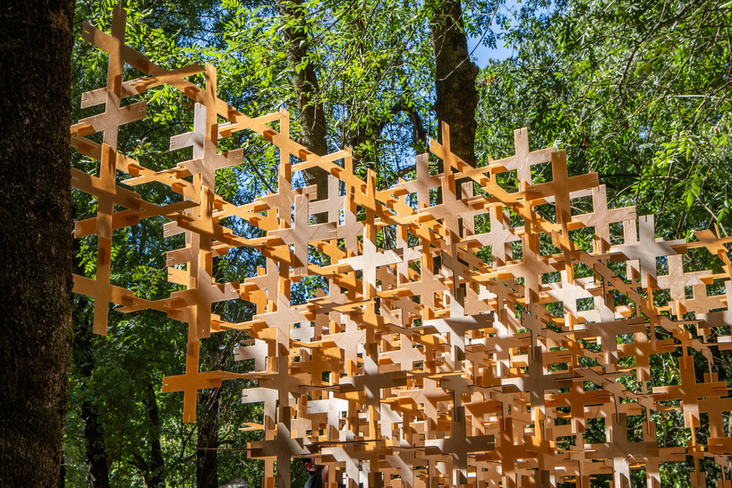 interlocking biodegradable modules weave regenerative pavilion into gavarres landscape - 2
