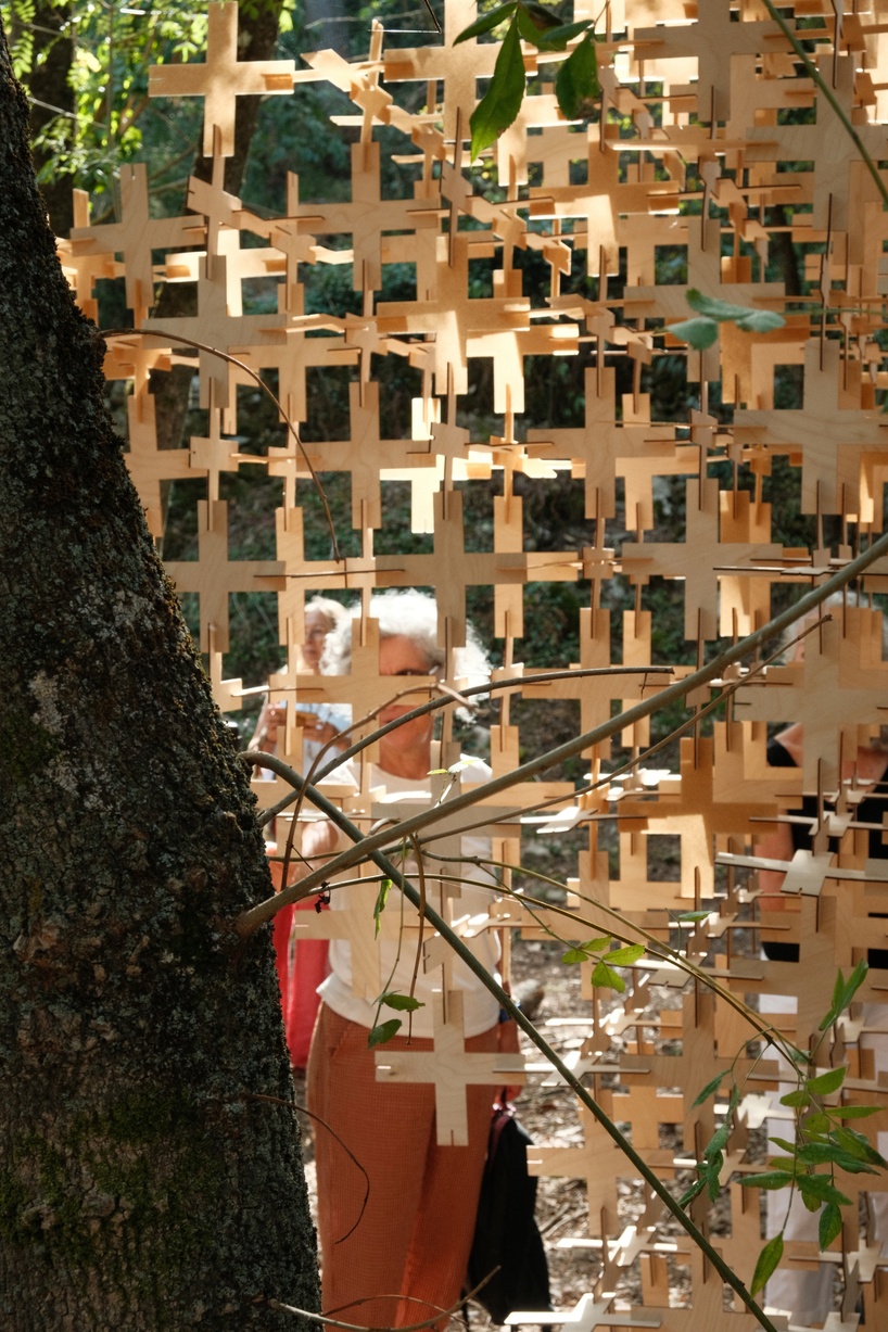 interlocking biodegradable modules weave regenerative pavilion into gavarres landscape - 6