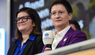 Two women at a London Stock Exchange event, one holding a microphone with the LSEG logo.