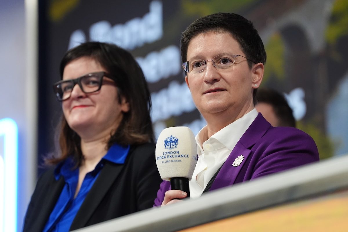 Two women at a London Stock Exchange event, one holding a microphone with the LSEG logo.