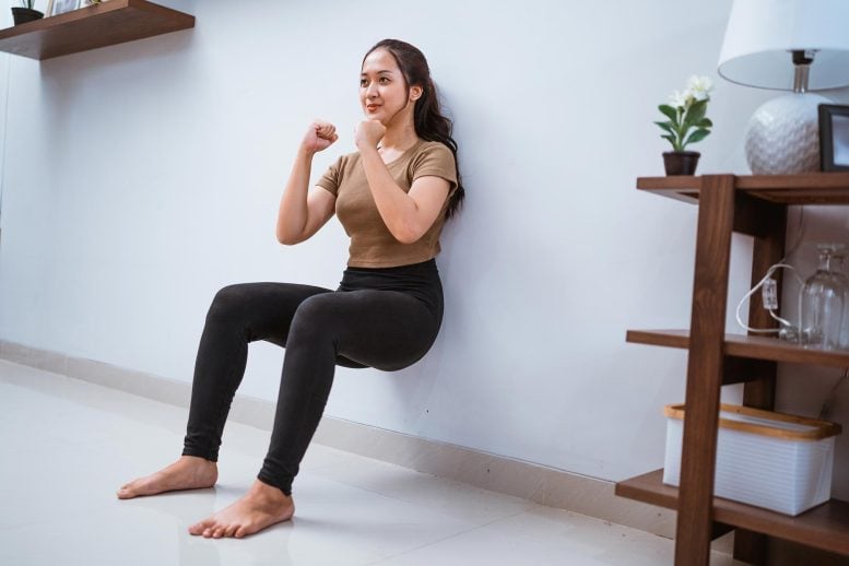 Asian Woman Wall Squat Sit Exercise