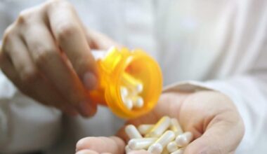 Pouring Pills From Prescription Medicine Bottle