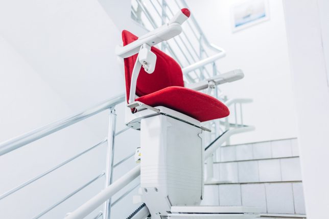 Red stair chair lift for people with disability