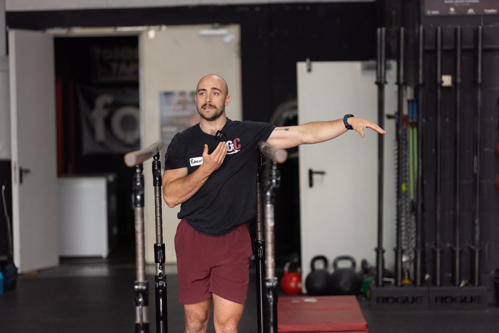 Gymnastics coach Barney Linssen coaching a group class