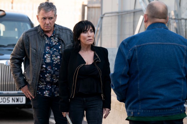 Kat and Alfie Moon confronting the cab salesman in EastEnders