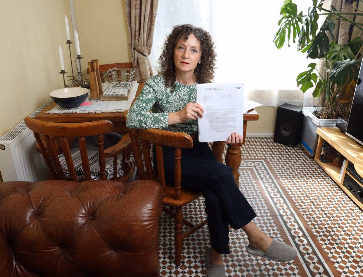 Lisa Blundell with some of her correspondence from the DWP at home in Kirkby