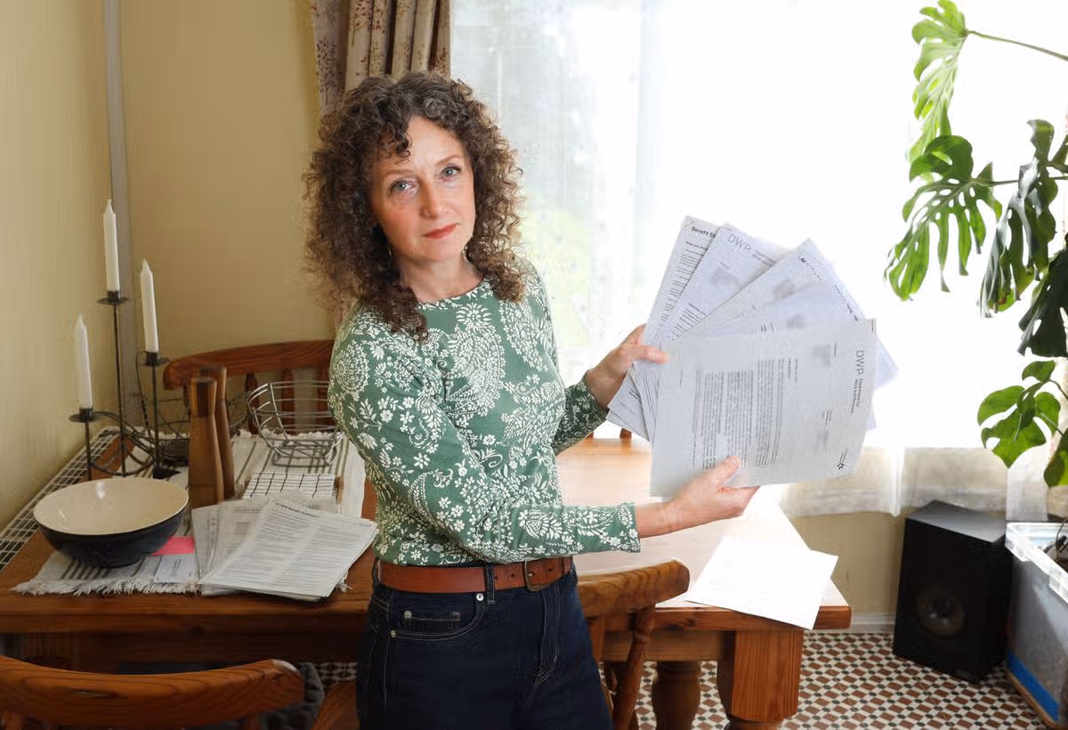 Lisa Blundell with some of her correspondence from the DWP at home in Kirkby