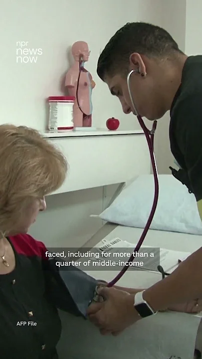 Nearly half of all Americans have trouble paying for basic necessities, survey finds - YouTube