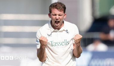 Matt Milnes in white with a double fist pump celebration