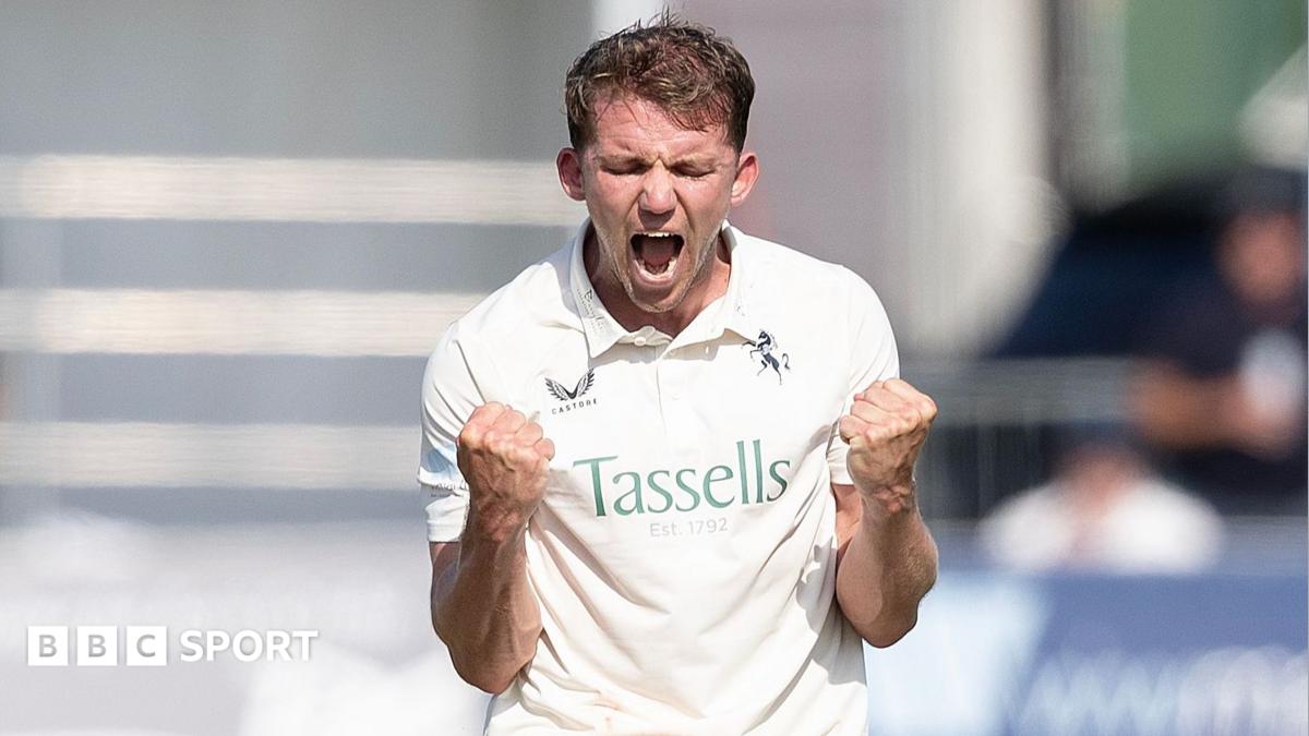 Matt Milnes in white with a double fist pump celebration