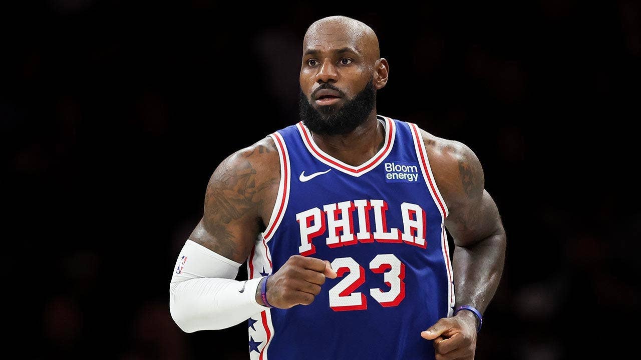 LeBron James doubles down with sneaky golf hip turns during national anthem after Trump's 'total disgrace' dig