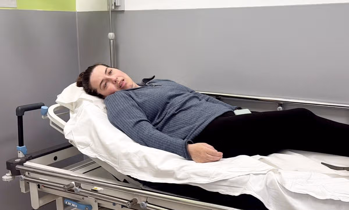 Nicola Crymble on a hospital bed