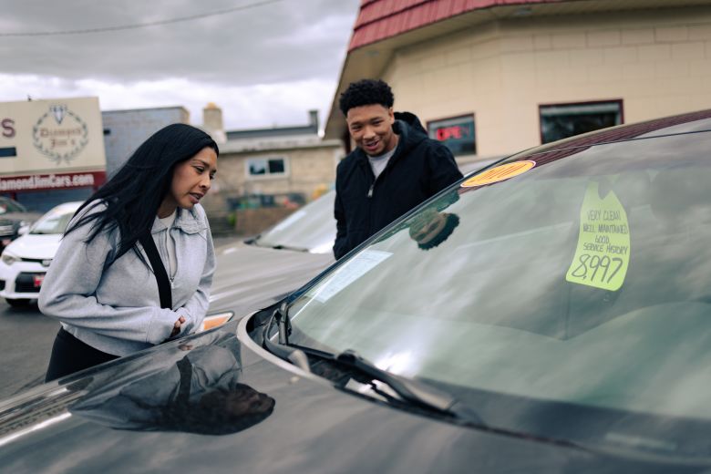 Mariza, pictured here with her eldest son, Justin, said she wants to help both her sons buy a car.