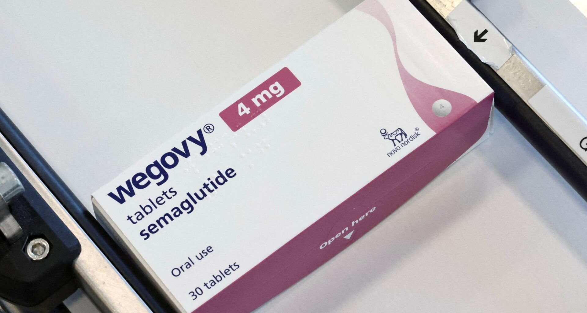 A box containing Wegovy tablets moves along a line at Novo Nordisk