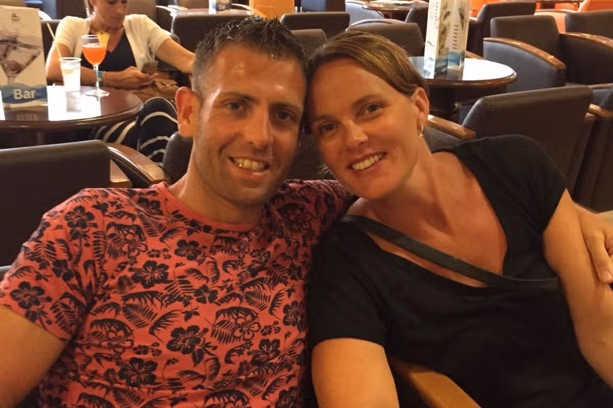 A smiling couple in a bar