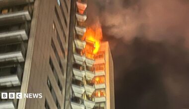 A tower block partly in flames