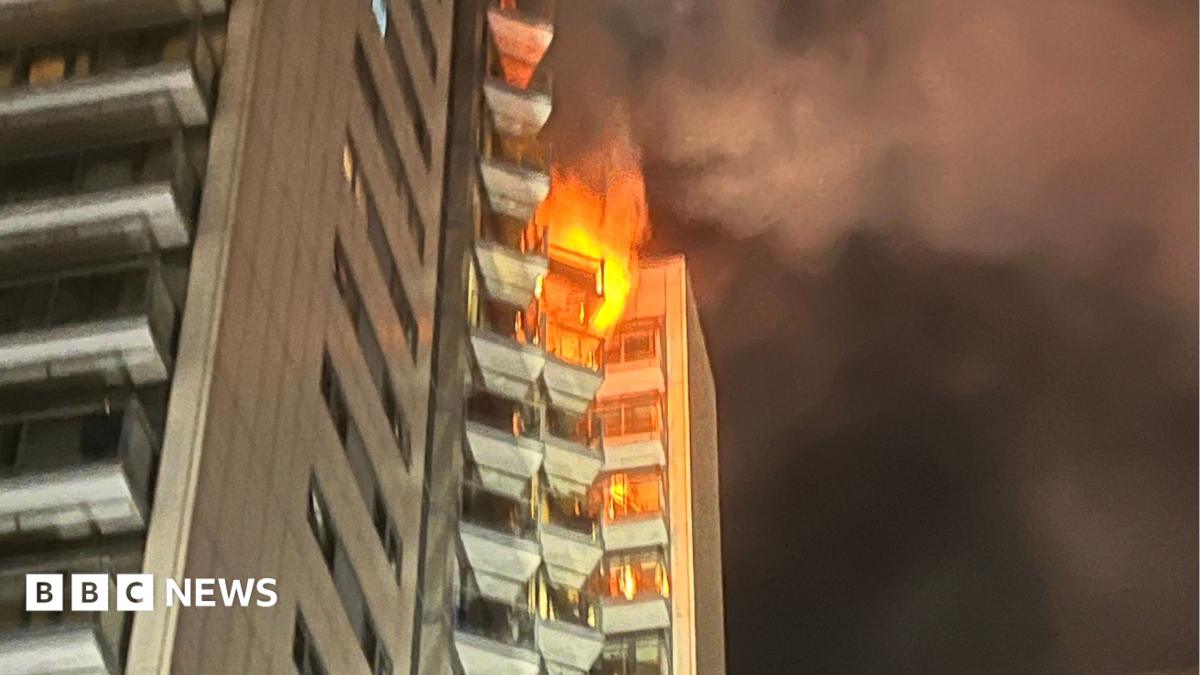 A tower block partly in flames