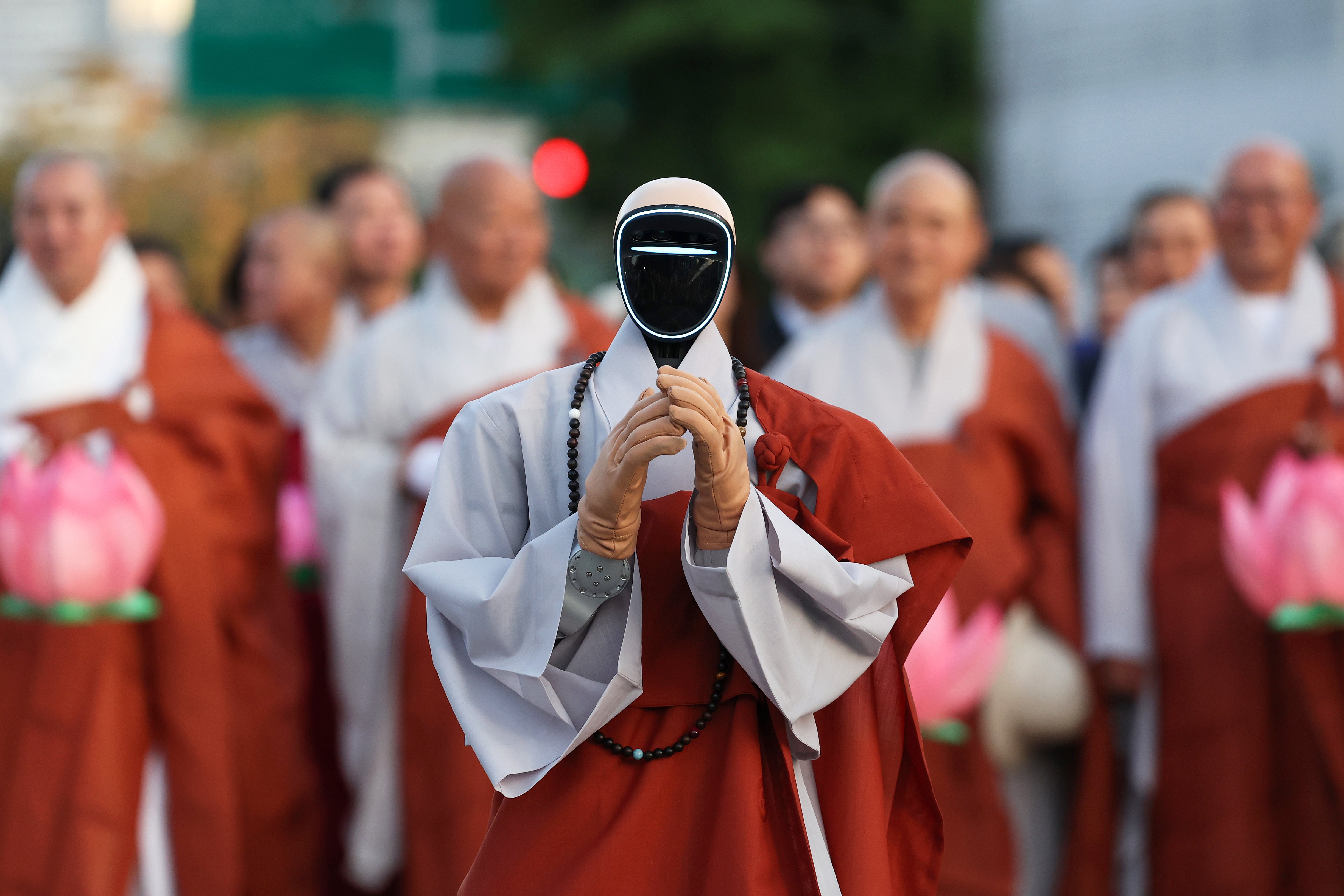 A humanoid robot dressed as a Buddhist monk attends the Lotus Lantern Festival to celebrate the forthcoming birthday of Buddha at the Jogyesa Temple in May, in South Korea