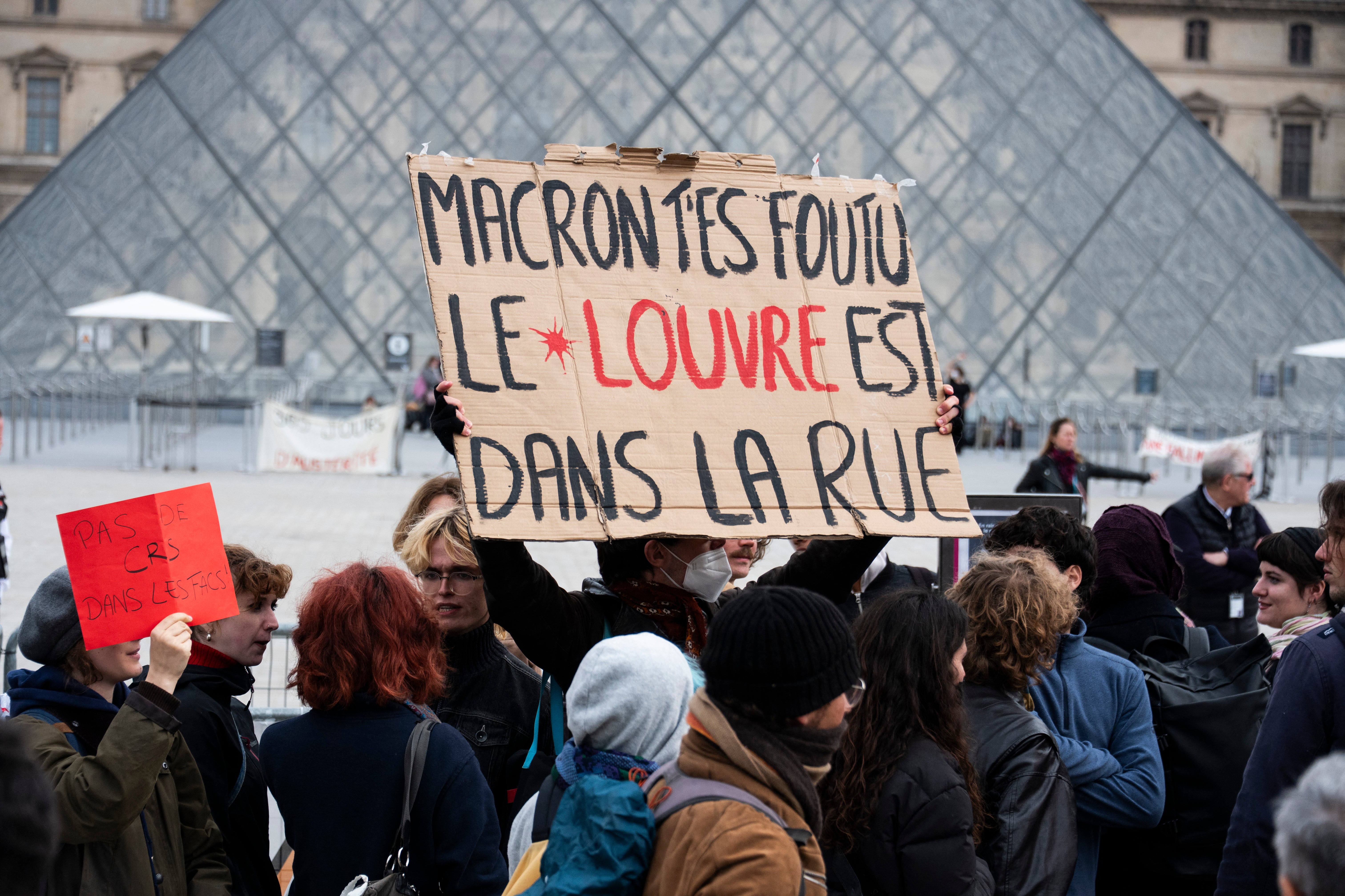 Protesters, including students from the Ecole du Louvre, block an entrance to the Louvre Museum to express their 