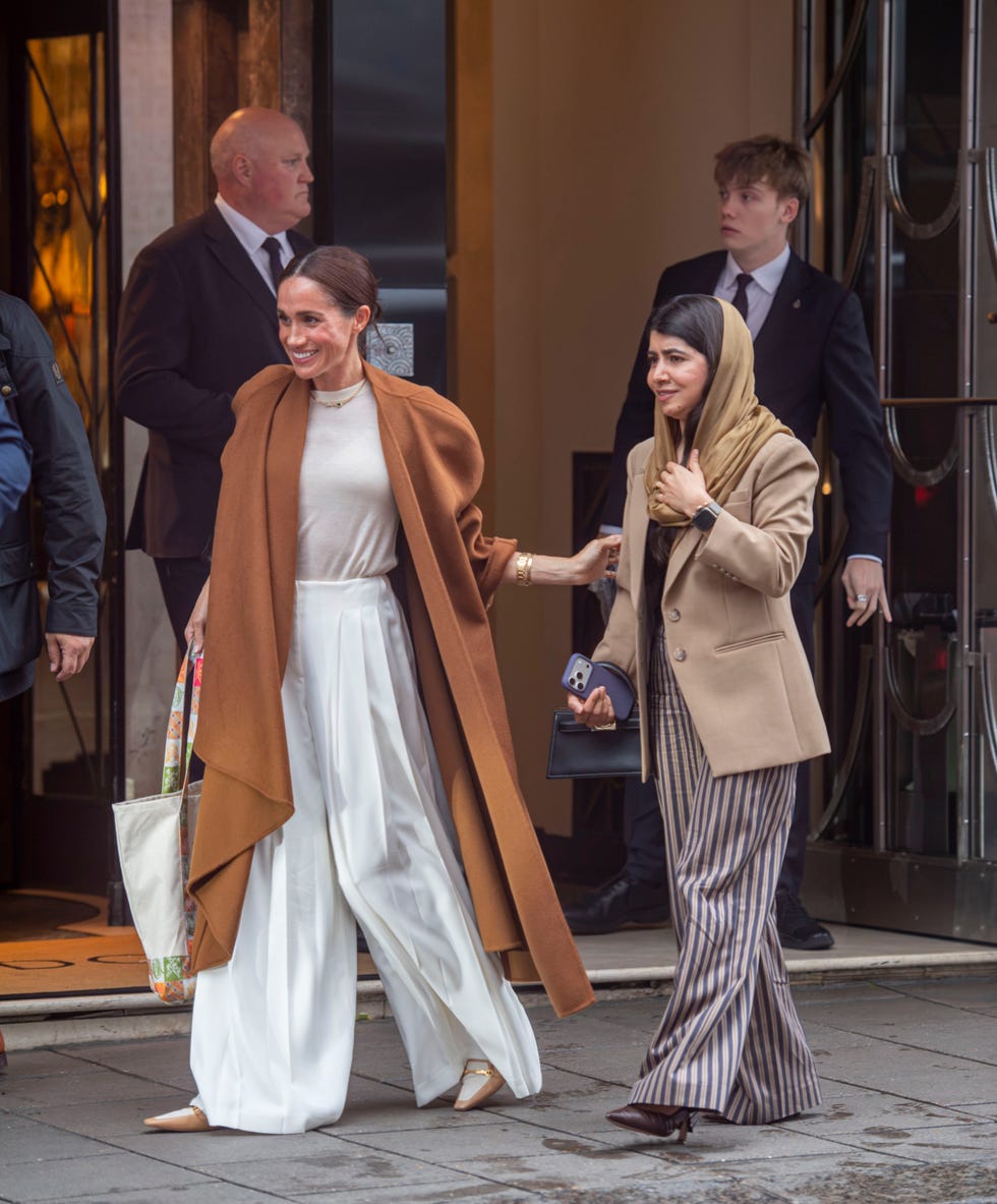 premium exclusive london, united kingdom strictly no subscriptions and no social media use meghan’s charity comeback duchess returns to her philanthropic roots following move back to britain as she enjoys glamorous claridge’s lunch with taliban shooting survivor malala yousafzai amid ongoing royal security row meghan markle appeared to be rekindling her british charity connections as she enjoyed a glamorous lunch with nobel peace prize winner malala yousafzai at londons exclusive claridge’s hotel the duchess of sussex, who recently returned to britain after six years in california, was all smiles as she warmly hugged malala goodbye outside the luxury mayfair hotel meghan looked chic in a tove studio coat, saint laurent shoes and a chanel handbag, accessorising with an emerald necklace by logan hollowell she also appeared to be carrying a gift bag featuring a striking design depicting women wearing hijabs but the meeting comes amid harry and meghan’s ongoing battle over taxpayerfunded police protection in britain — an issue malala has experienced in the most terrifying circumstances for malala, the danger became a horrifying reality when taliban gunmen shot her in the head aged just 15 for campaigning for girls’ education the nobel peace prize winner has previously received british police protection, with police vehicles spotted outside claridge’s during the lunch, clearly identifiable by their distinctive number plate lights malala was later seen leaving in one of the vehicles, as the sussexes’ own security arrangements face a fresh review following their return to britain the two women previously joined forces in 2020 for a video discussion marking international day of the girl, with their latest reunion coming amid reports that meghan is looking to reconnect with british charities strictly no subscriptions and no social media use pictured meghan markle malala yousafzai backgrid usa 8 october 2026 usa 1 310 798 9111  usasalesbackgridcom uk 44 208 344 2007  uksalesbackgridcom uk clients  pictures containing children please pixelate face prior to publication