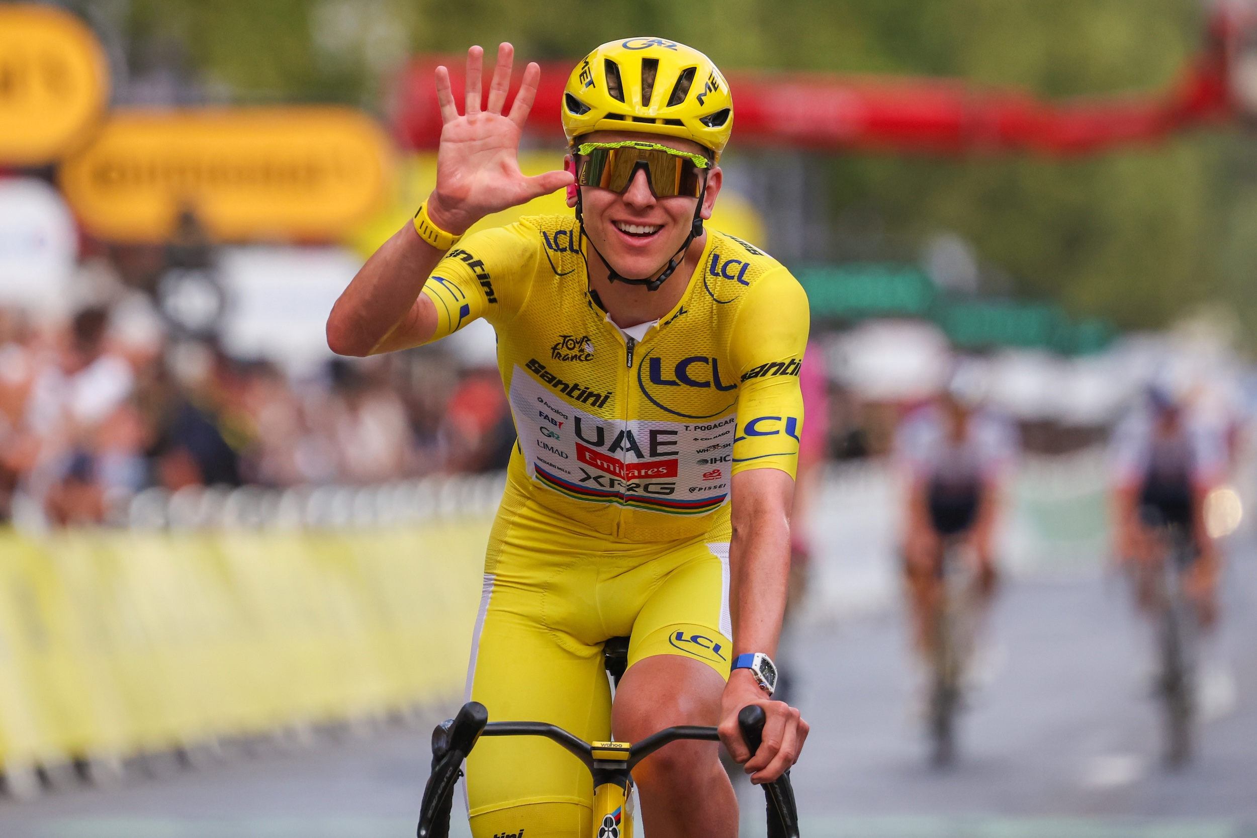 Tadej Pogačar celebrates at finish line his fifth overall victory at 2026 Tour de France