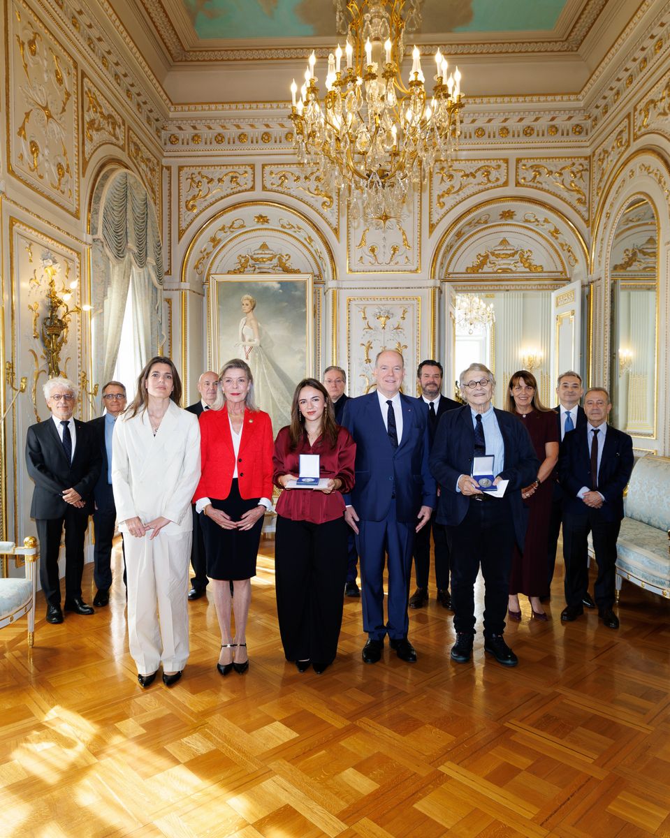 Princess Caroline and Charlotte Casiraghi joined Prince Albert to welcome the Prince Pierre Foundation’s literary prize winners at the palace, with Grace Kelly’s portrait visible behind them.